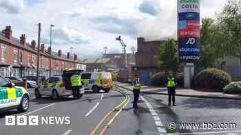 Shopping centre shut as 50 firefighters tackle nearby blaze