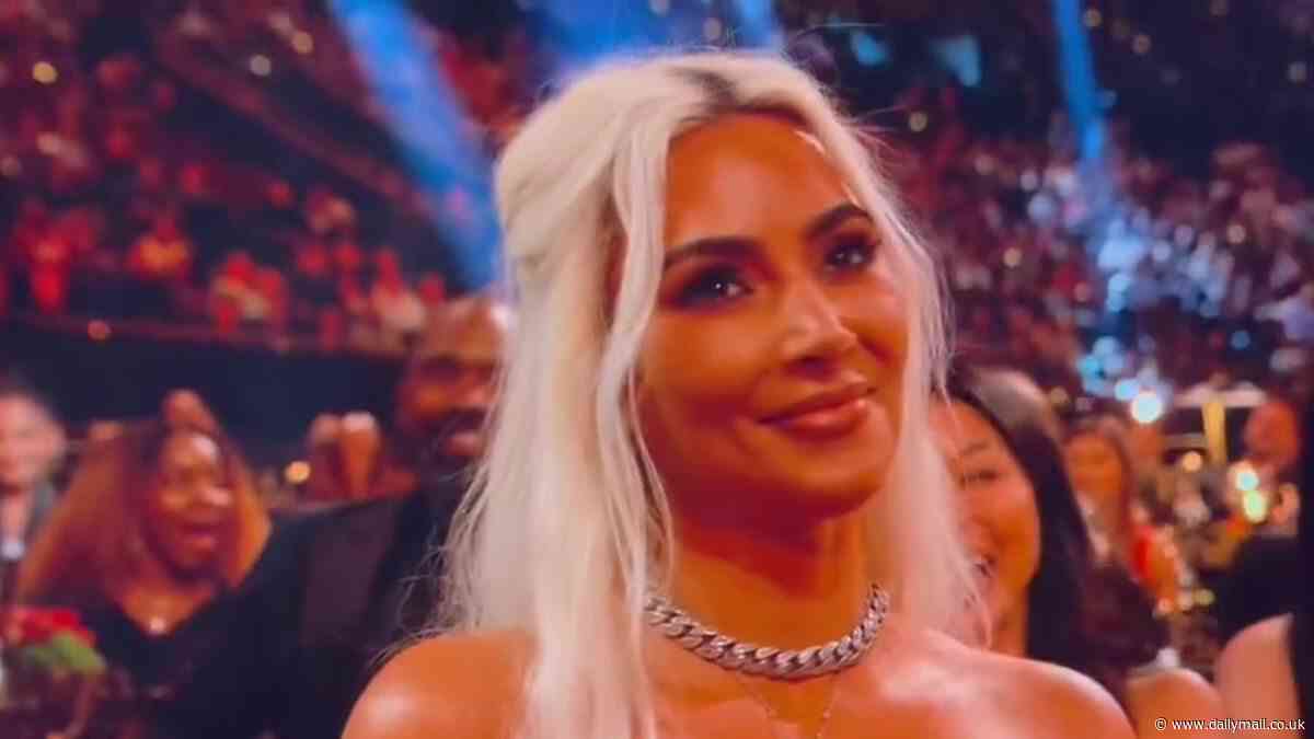 Kim Kardashian does not look pleased as Tom Brady jokes she was afraid to go to the roast 'because her kids are at home with their dad'