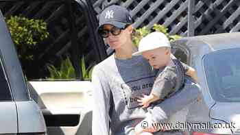 Paris Hilton, 43, makes the rare move of taking her son Phoenix, one, out during errand run in LA as she models a You Are Beautiful T-shirt