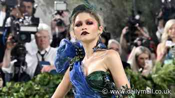 Zendaya's forbidden fruit look divides the Internet! Star's peacock-colored Maison Margiela mermaid gown and edgy makeup ruffles feathers at 2024 Met Gala after five year hiatus