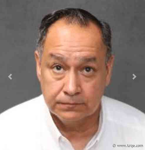 Albuquerque school director charged with threatening student turns himself in