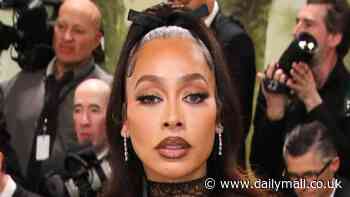 La La Anthony stuns in black lace Alexander McQueen gown with red floral details as she arrives at 2024 Met Gala