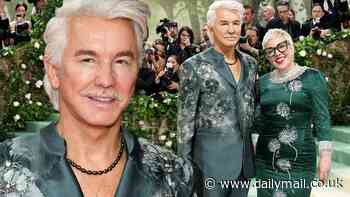 Baz Luhrmann, 61, shows off his taut visage and rocks an embroidered suit as he joins fashion designer wife Catherine Martin at the Met Gala 2024