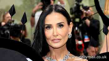 Demi Moore stuns at 61! Charlie's Angels star flutters down red carpet in butterfly-inspired dress with sculptured wings at 2024 MET Gala