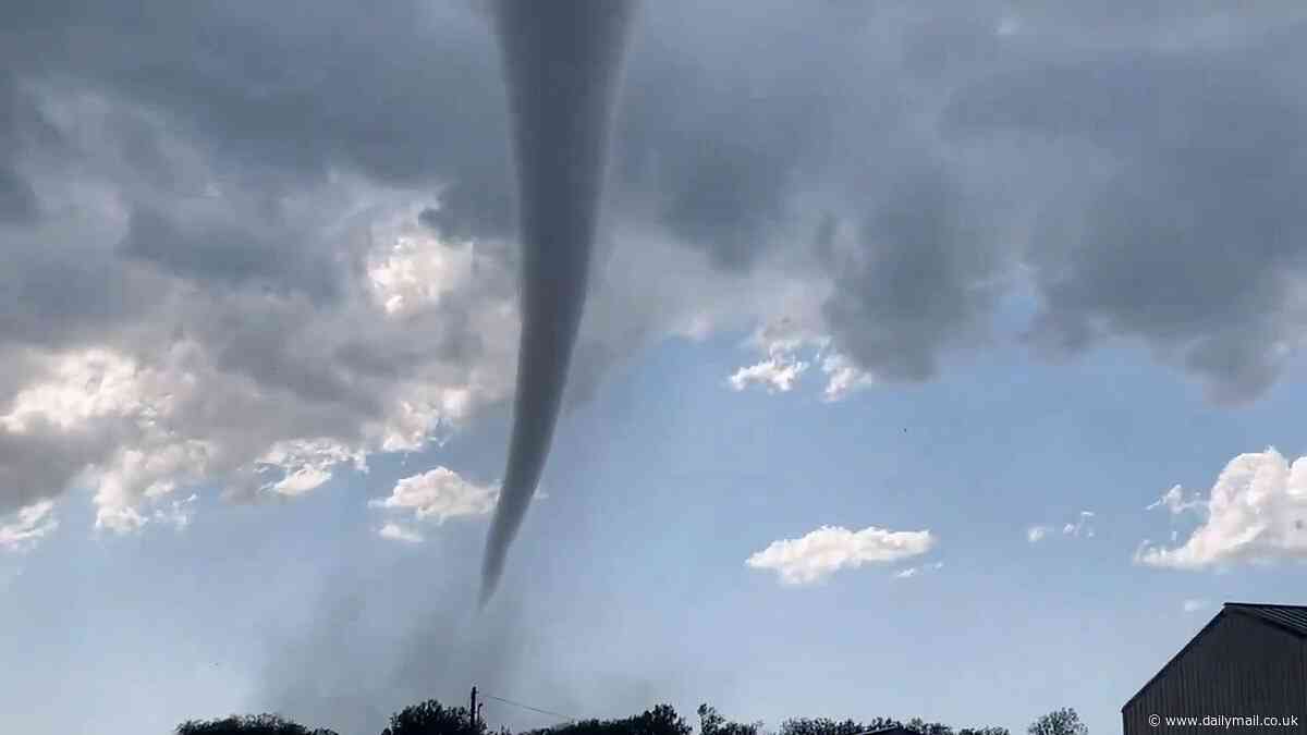 Tornados touch down in Oklahoma and high winds delay or cancel more than 1,100 flights out of Denver and prompt military bases to evacuate in latest wild weather to pummel the Midwest