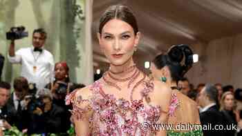 Karlie Kloss sparkles as she shows off her model figure in a pink crystal-embellished Swarovski gown at the 2024 Met Gala