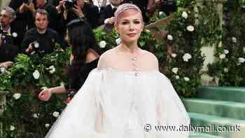 Michelle Williams puts on a leggy display in thigh-skimming Chanel dress as she debuts pink hair at the 2024 Met Gala
