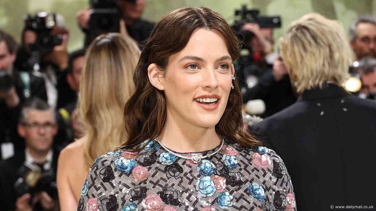 Riley Keough flashes her toned midriff in floral gown with sheer midsection and sweeping train at Met Gala 2024