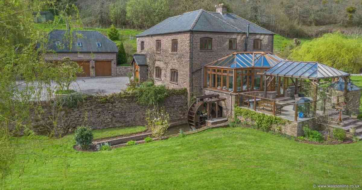 Rural dream home with working mill wheel and log cabin in an enchanting garden