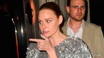 Stella McCartney turns heads in a dazzling silver minidress as she totters to her car following Met Gala afterparty