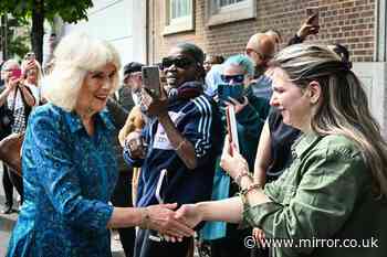 Queen Camilla beams with schoolkids less than a mile from Prince Harry's Invictus event