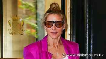 Elsa Pataky turns heads in bold pink outfit as she and Chris Hemsworth depart their hotel in New York after Met Gala