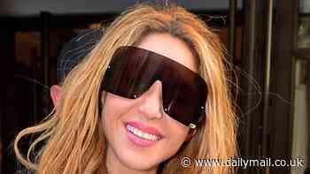 Shakira looks chic in a shiny black jacket and oversized sunglasses after making her stunning Met Gala debut