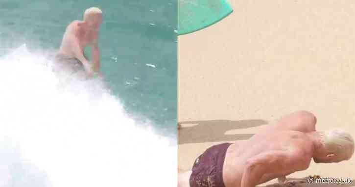 Streamer Tfue collapses after being hit by huge wave while skimboarding
