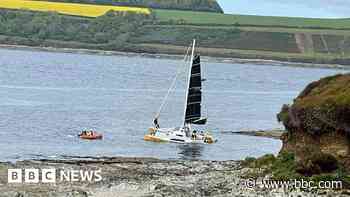 Three rescued from sinking catamaran during race