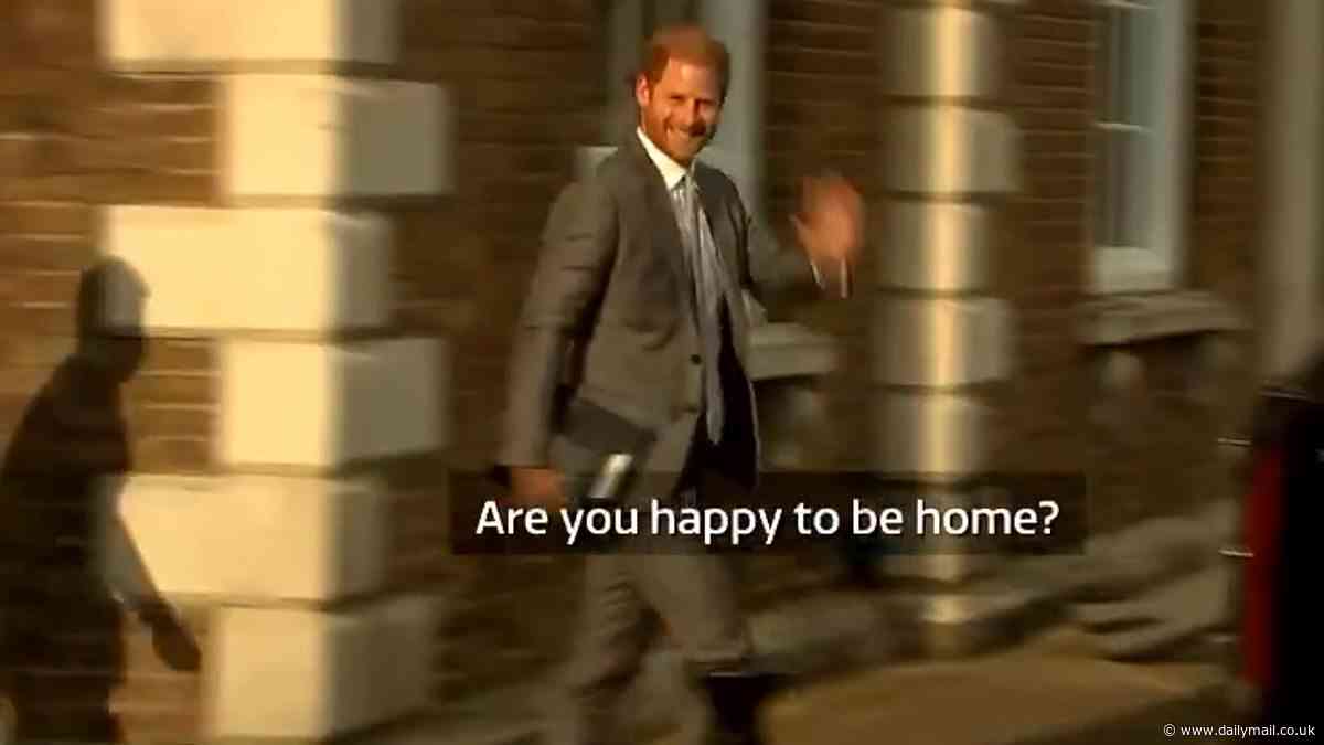 Moment Harry chuckles as he's asked 'are you happy to be home' during whistle-stop trip to the UK - after it emerged he WON'T see the King because his father's too busy