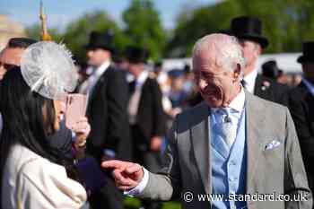 King Charles appears in good spirits with guests at Buckingham Palace garden party