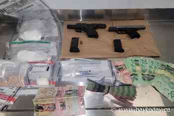 Drugs, guns and cash seized during hotel search warrant