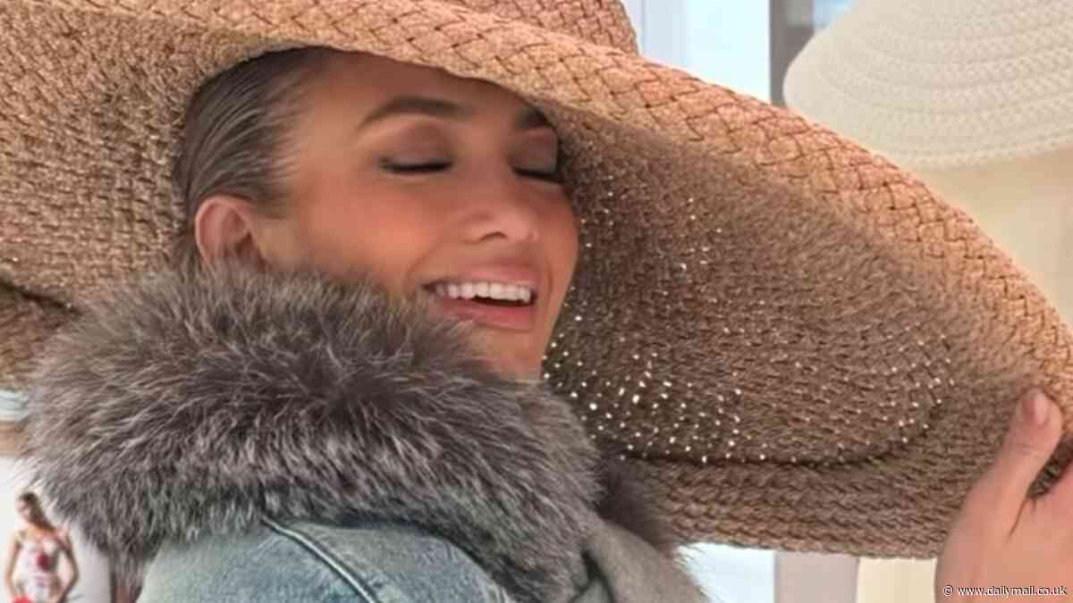 Jennifer Lopez models a giant straw hat during an 'exquisite moment' on a girls trip to Paris... after co-chairing the Met Gala in NYC