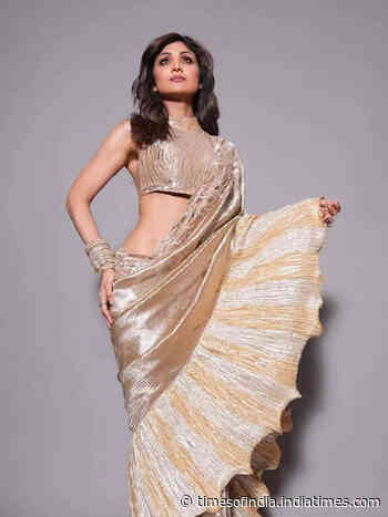 Shilpa sets the bar high in a metallic gold saree