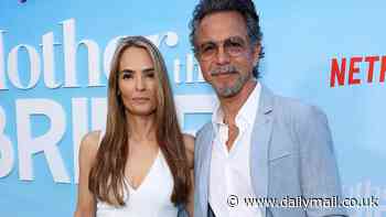 Julia Roberts' ex Benjamin Bratt, 60, makes rare move of snuggling up to his stunning Bond girl wife Talisa Soto, 57, at the Mother Of The Bride premiere