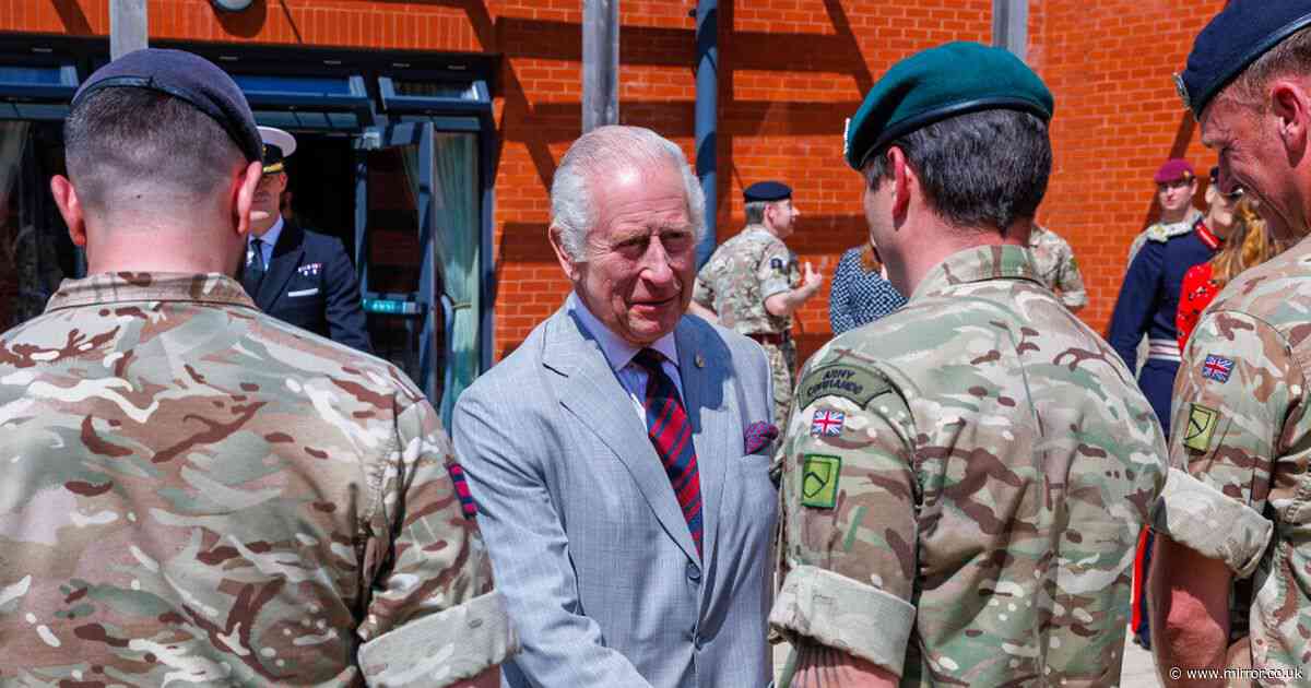 King Charles 'glad to be out of cage' as he meets military families hours after Prince Harry snub