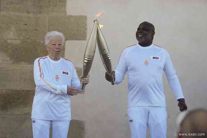 Torchbearers begin Olympic flame's journey across France