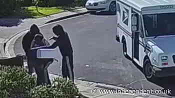 Armed robbery of US postal worker caught on CCTV in California