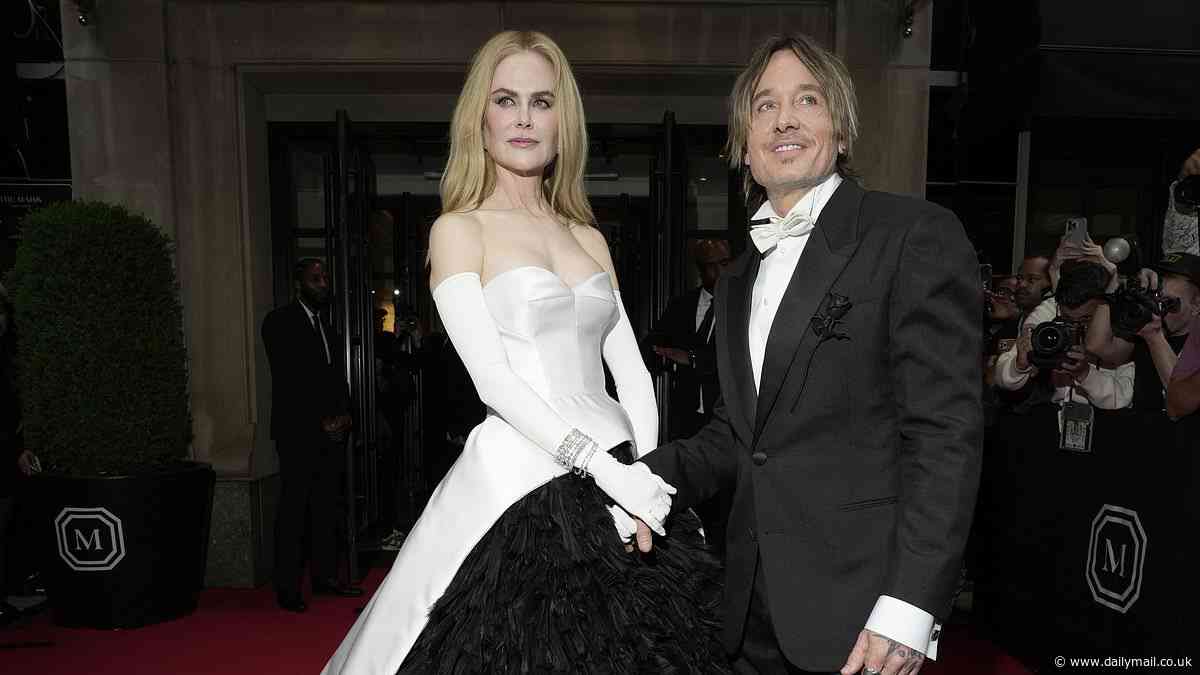 Keith Urban says 'it fires me up a bit more' when wife Nicole Kidman watches him perform on stage... ahead of their 18th wedding anniversary: 'I try to impress her'