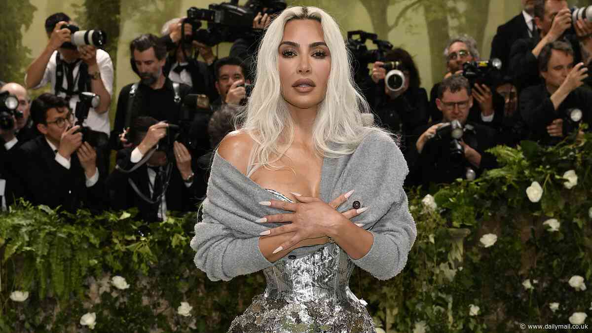Kim Kardashian looks overjoyed to be out of her corset as she's pictured BACK in NYC for a photoshoot