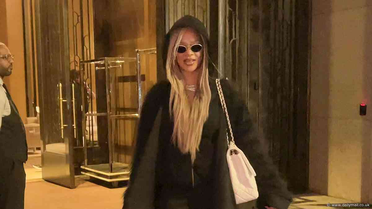 Rihanna is the picture of style in sleek black dress and hoodie as she is pictured for the first time since skipping Met Gala 'due to flu'