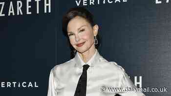 Ashley Judd keeps it business chic in a white satin shirt, black tie, and black trousers at Lazareth screening in NYC