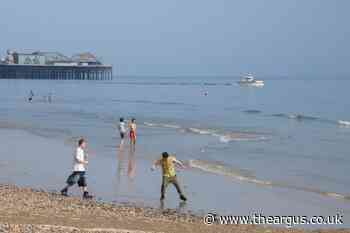 Brighton beachgoers enjoy sand during low tide