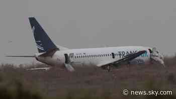 Plane skids off runway injuring at least 10 people