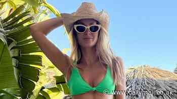 Millie Mackintosh flashes her taut abs in a stylish green bikini as she shares throwback holiday snap