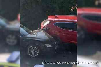Audi crashes into four parked cars