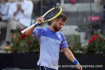 Djokovic wins his opener at the Italian Open after a month off. Defending champ Rybakina withdraws