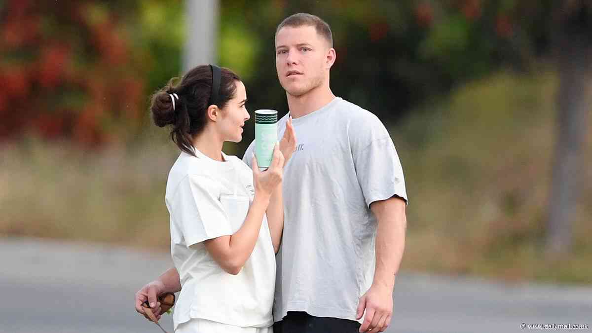 Olivia Culpo and fiancé Christian McCaffrey pictured walking hand in hand as the countdown to their wedding continues
