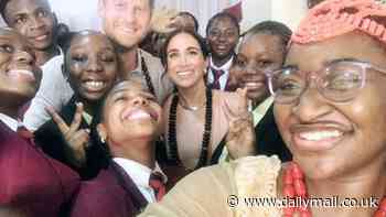 Meghan in her element!: Duchess of Sussex dutifully poses for selfies with excited children alongside Prince Harry as couple's quasi-royal tour of Nigeria continues