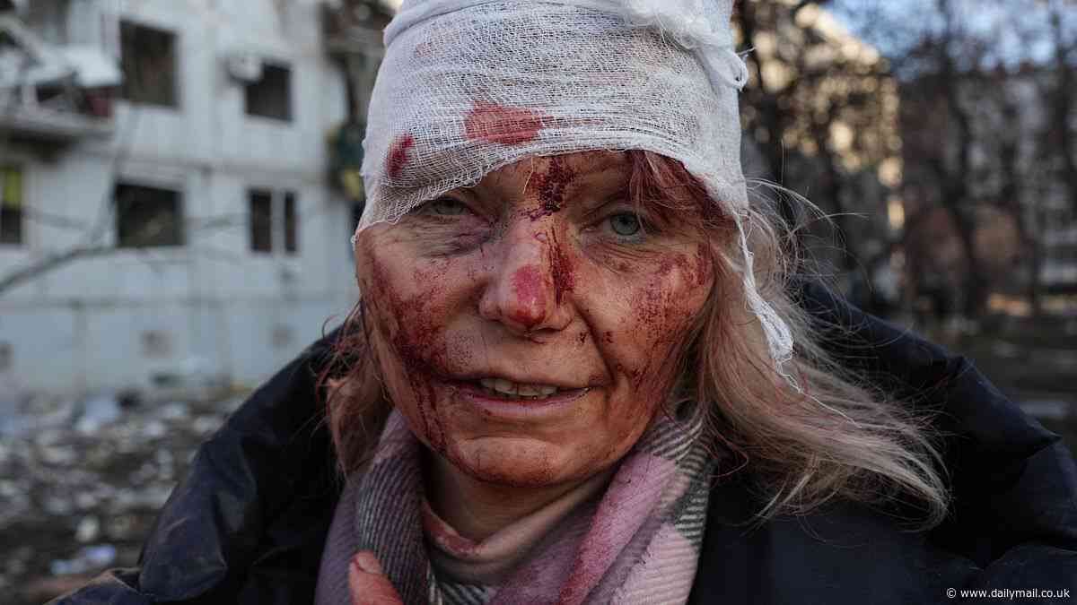 As Kharkiv is struck again, this teacher's expression tells a story of her country's ongoing agony - as she stared sorrowfully at the camera while cowering from an airstrike