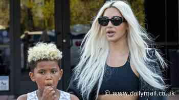 Kim Kardashian matches blonde hair with son Saint, eight, as they arrive at his basketball game... with ex Kanye West sneaking in separately
