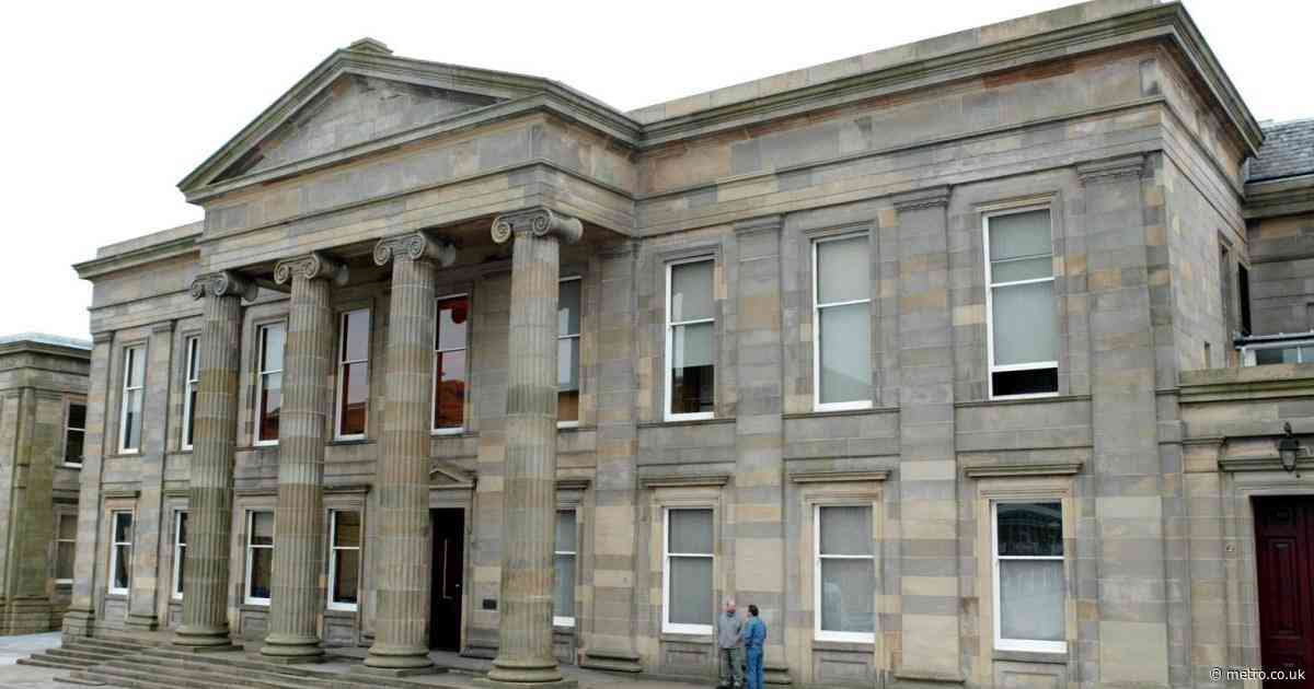 Woman admits dangling four-month old baby from third-floor window
