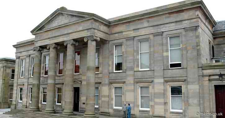 Woman admits dangling four-month old baby from third-floor window