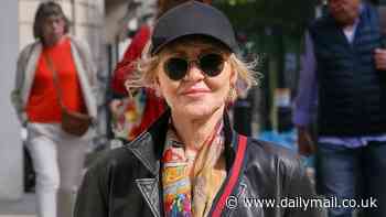 Lulu, 75, cuts a quirky figure in a graphic leather jacket and vintage Gucci belt bag as she steps out in sunny London