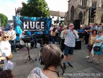 Party band Huge performed live in York's Parliament Street today