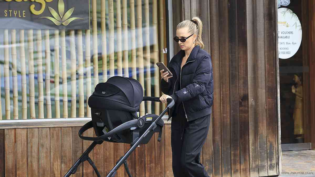New mother Anna Robards looks chic as she dotes on newborn daughter Ruby while taking the tot for a stroll in Sydney