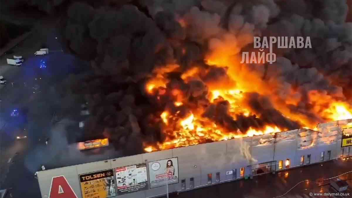 Massive shopping centre in Warsaw is destroyed by raging inferno as blanket of thick smoke covers the Polish capital amid suspicions of 'arson'