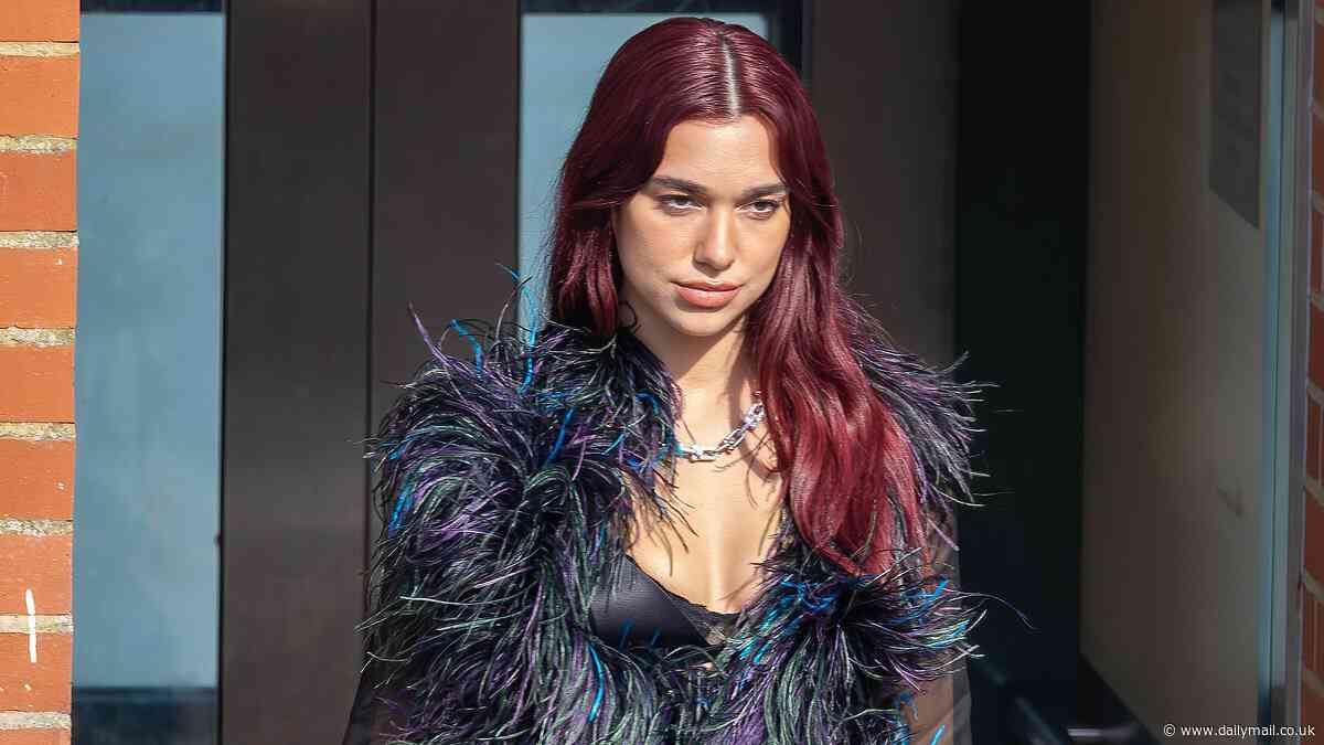 Dua Lipa slips into a black feather cardigan and leather trousers on the hottest day of the year as she films a new advert in Kent