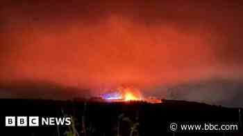 Firefighters tackle wildfire on hill after extreme warning