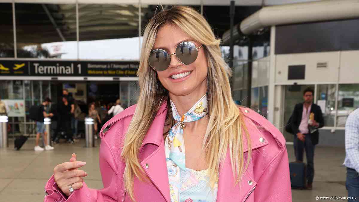 Heidi Klum bundles up in pink leather jacket as she arrives in France before teasing a 'very special' announcement at Cannes Film Festival